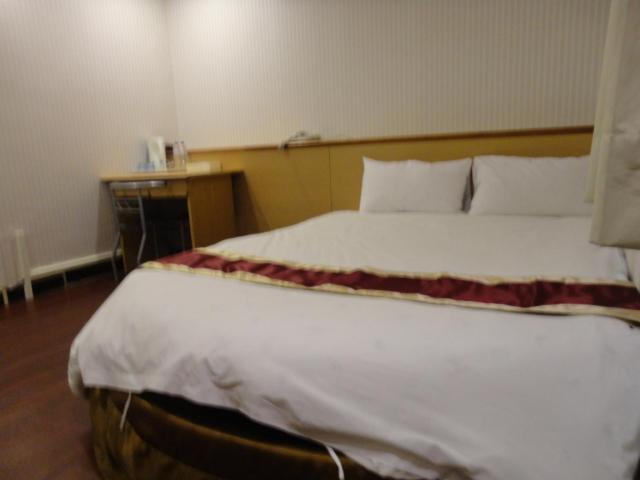 Postel nebo postele na pokoji v ubytování Yi Pin Yuan Hotel