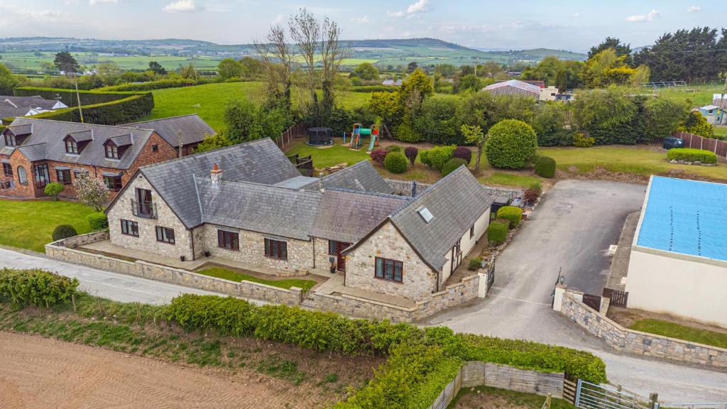 an aerial view of a house with a swimming pool at Arosfa in Holywell