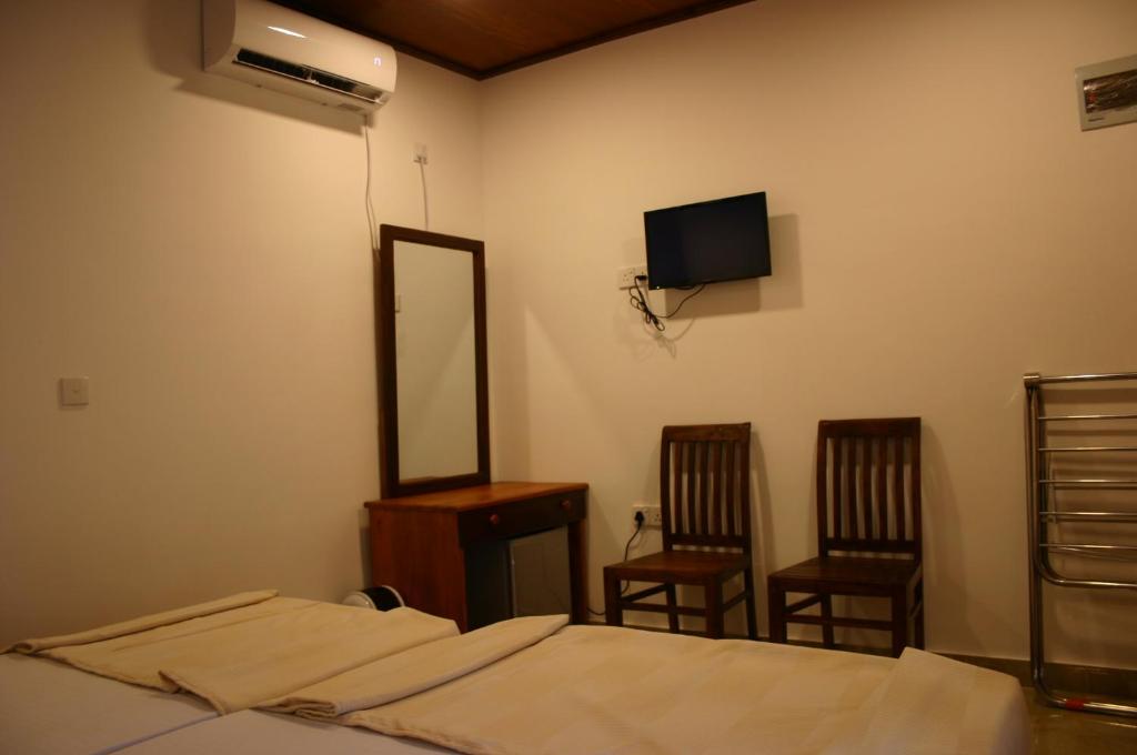 Postel nebo postele na pokoji v ubytování JKAB Park Hotel