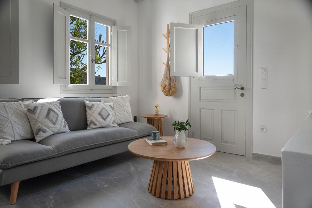 a living room with a couch and a table at Limonletto in Patmos