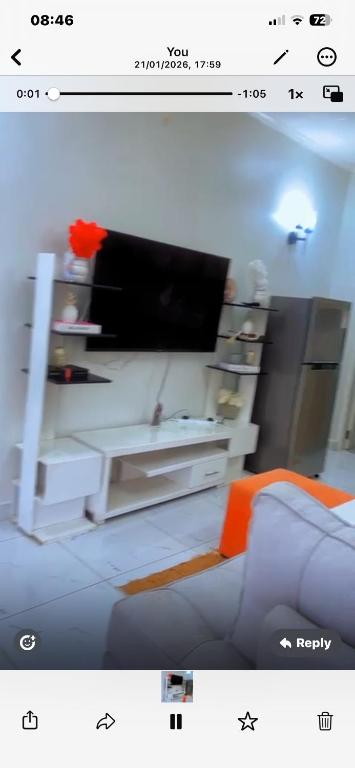 a picture of a living room with a couch and a tv at Kiminini bnb in Kitale