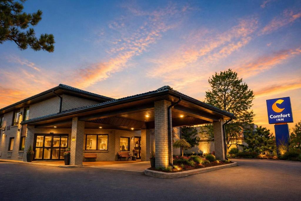 a building with a sign in front of it at Comfort Inn in Huntsville
