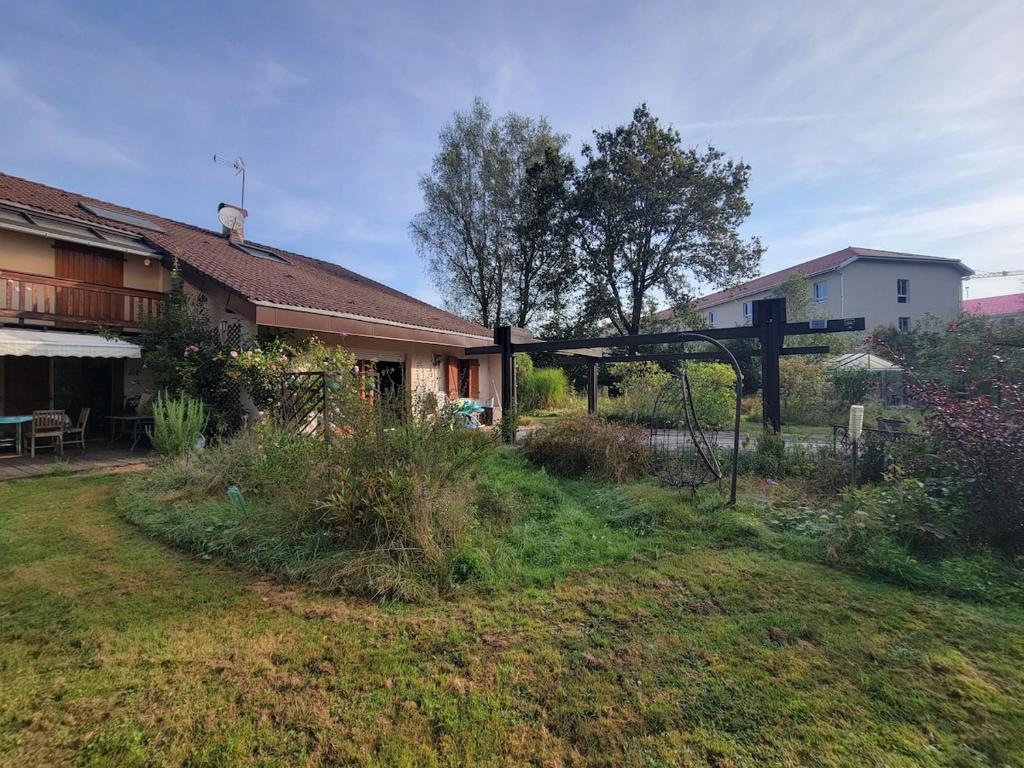 a house with a yard with a fence and a house at Peaceful Vosges heaven in Granges-Aumontzey