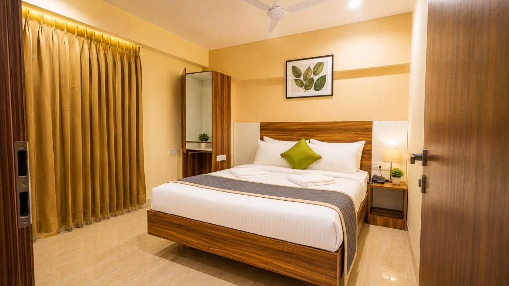 a bedroom with a bed in a room at Urban Comforts - Near US Consulate Business Hotel in T Nagar in Chennai