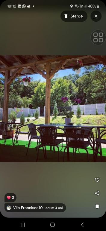 a picture of a patio with tables and chairs at Vila Francisca10 in Alba Iulia
