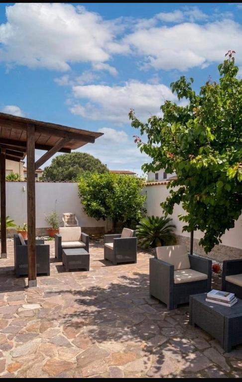 a patio with couches and a gazebo at Giorgia Airport 2 Fiumicino in Fiumicino