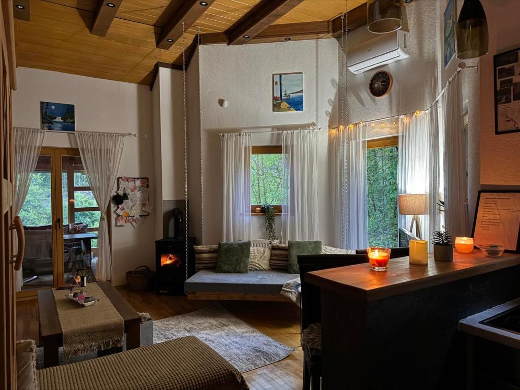 a living room with a couch and a table at Vikendica Šehić in Zavidovići