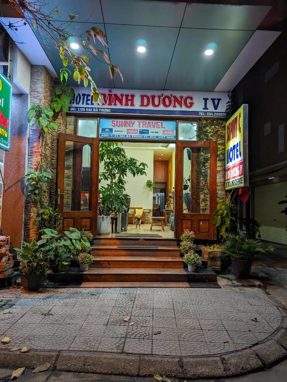 a building with a sign that reads quiet duing tv at Sunny C Hotel in Hue