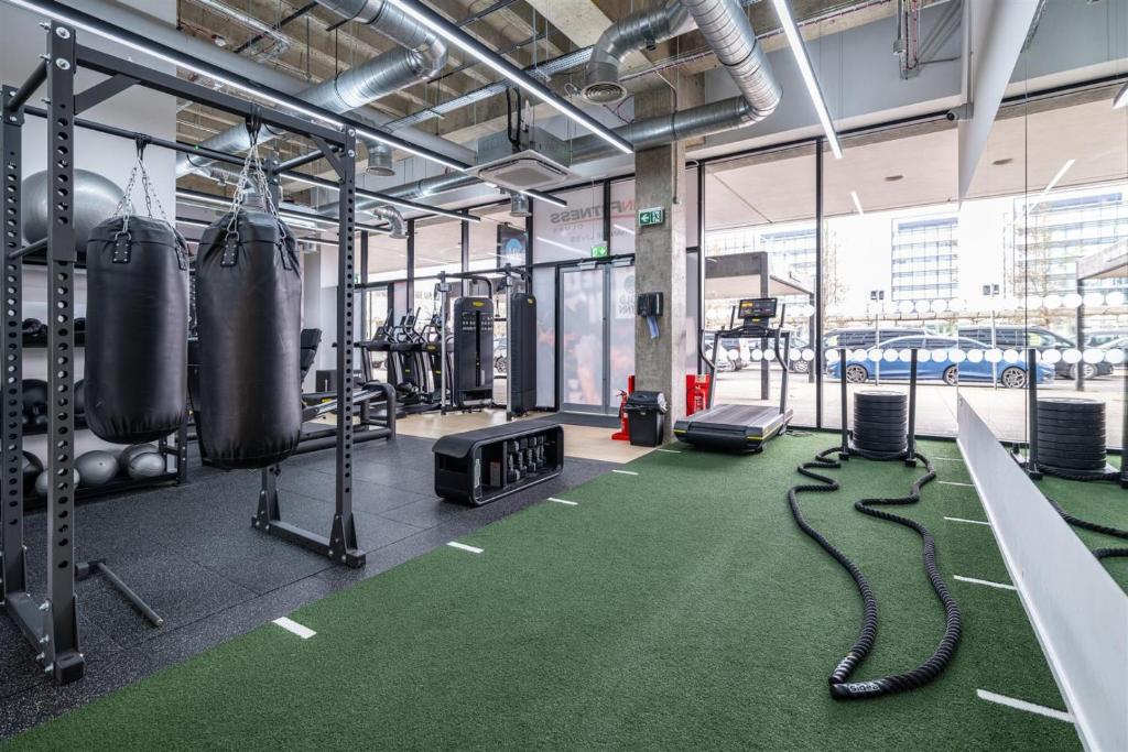 a gym with two ropes on the floor at Station Gold Leaf - Gym - Games Room - MK in Milton Keynes
