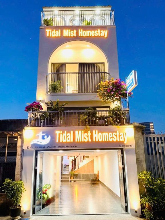 a building with aigil mustharley sign on it at Tidal Mist Homestay in Long Hai