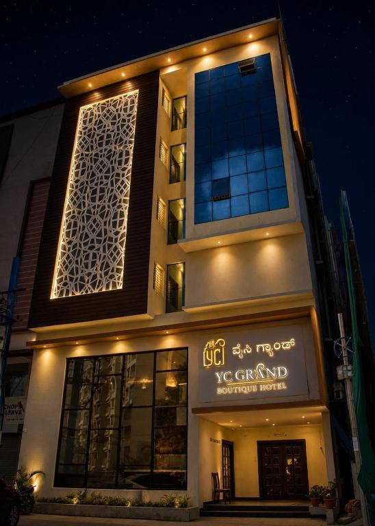 a building with a sign on the side of it at YC Grand Mystic Premier, Electronic City in Bangalore