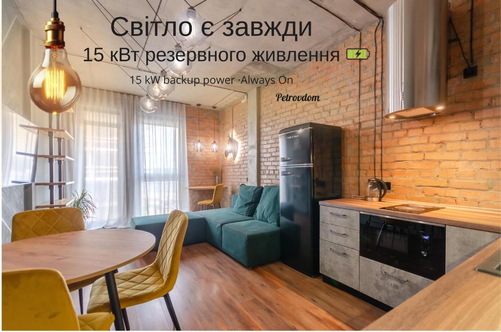 a kitchen and a living room with a couch and a table at 3-217 Rybalsky, Naberezhno Rybalska 3, Kyiv centre, panoramic city view, 15 kW backup power, Petrovdom Apartment in Kyiv