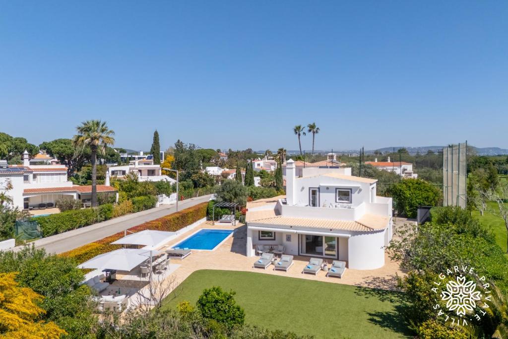 an aerial view of a villa with a swimming pool at Villa Benjamin - Vale do Lobo in Vale do Lobo