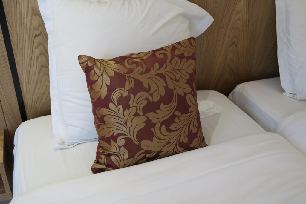 Postel nebo postele na pokoji v ubytování Central Hotel