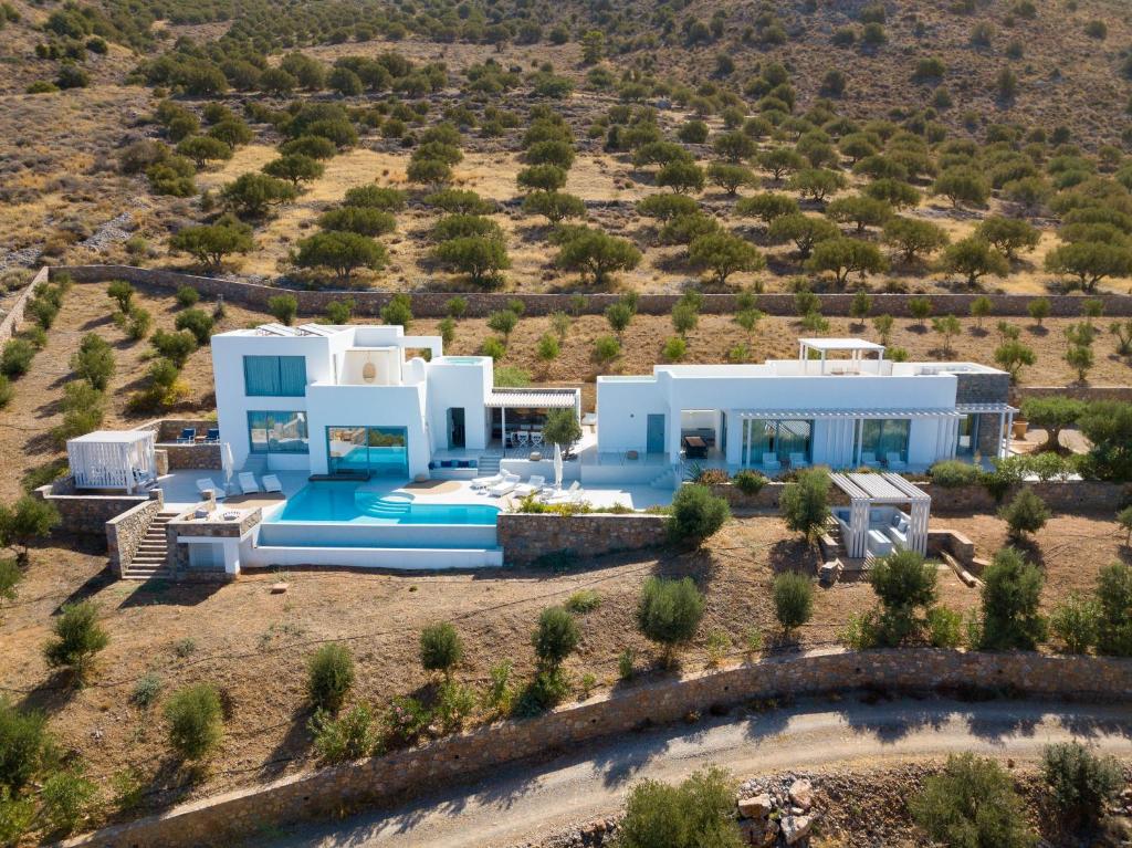 an aerial view of a villa with a swimming pool at Luxury Villa with Panoramic Sea Views in Thólos
