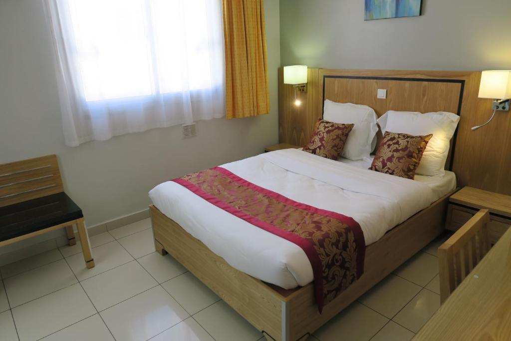 Postel nebo postele na pokoji v ubytování Central Hotel