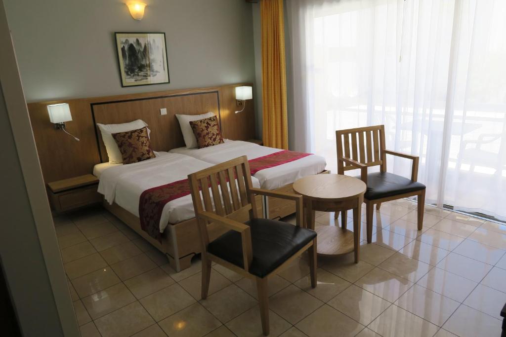 Postel nebo postele na pokoji v ubytování Central Hotel