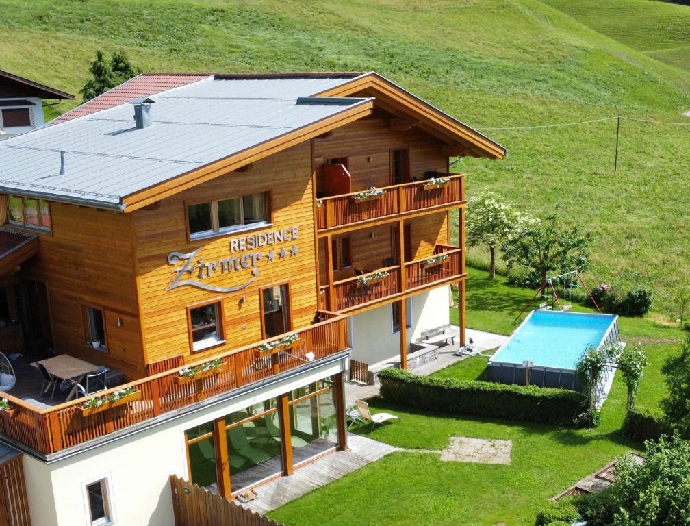 an aerial view of a house with a pool at Residence Zirmer Wohnung Luft in Castelrotto