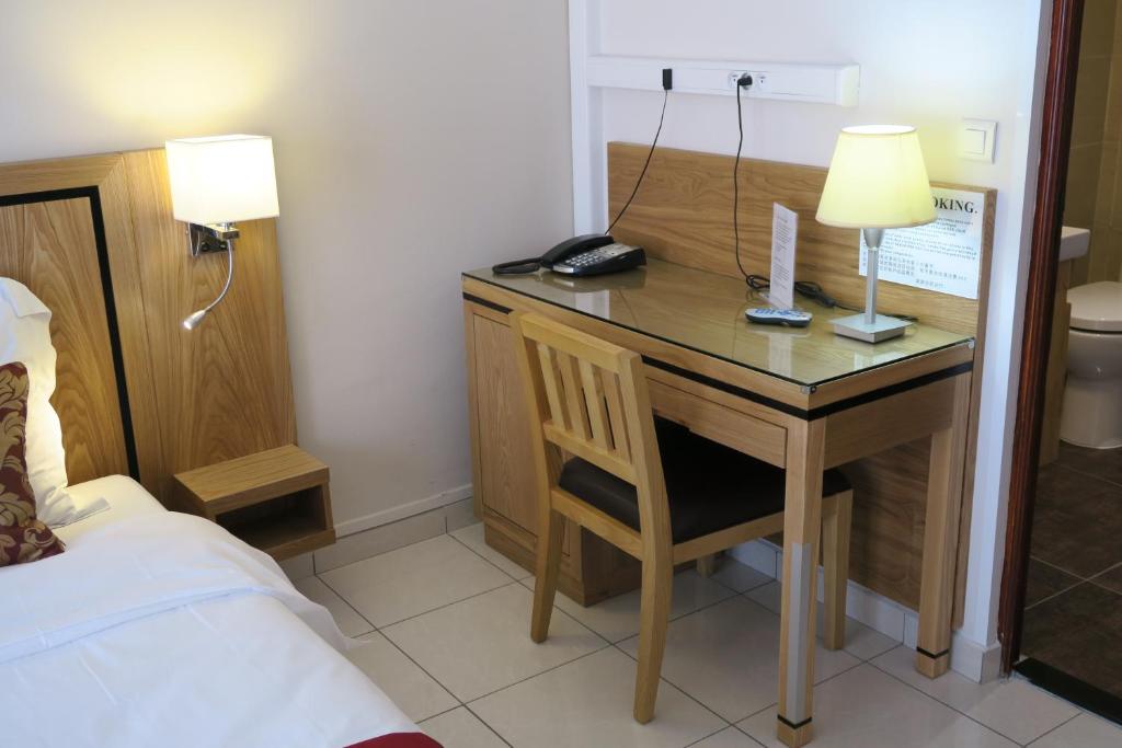 Postel nebo postele na pokoji v ubytování Central Hotel