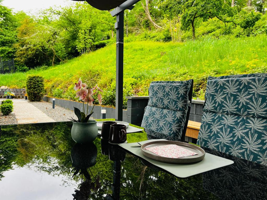 a table and chairs with a plate on a table at Traum Berg - Koppelberg 2 in Traben-Trarbach