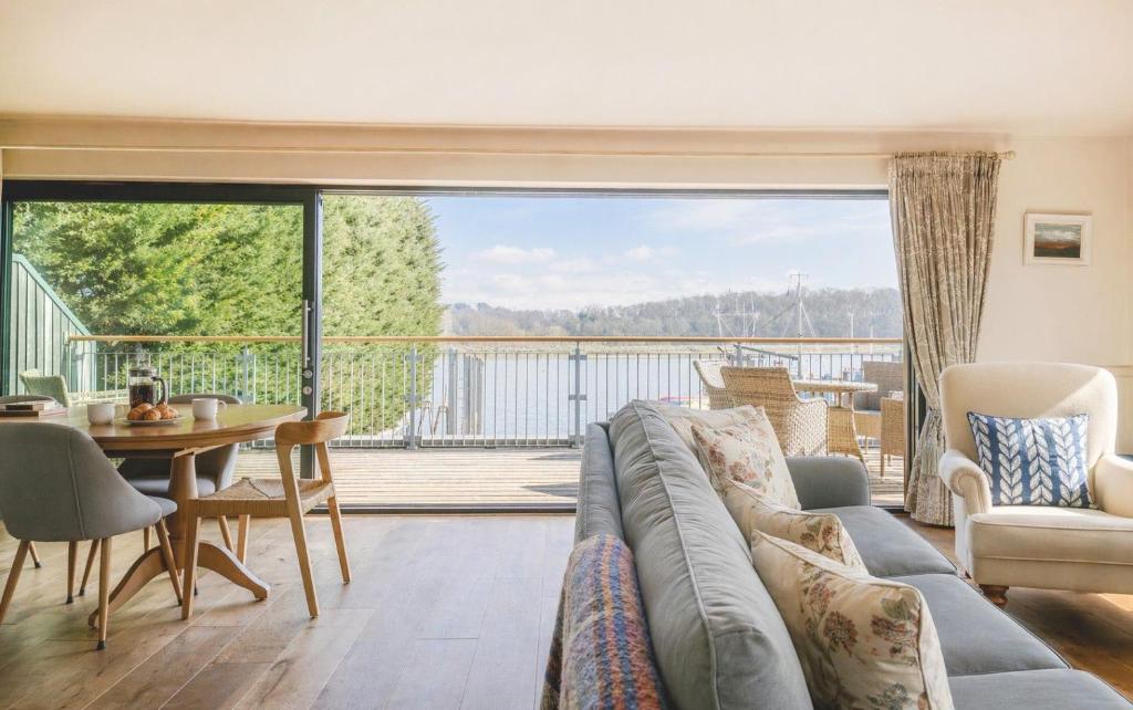 a living room with a couch and a table at The Crow's Nest in Woodbridge