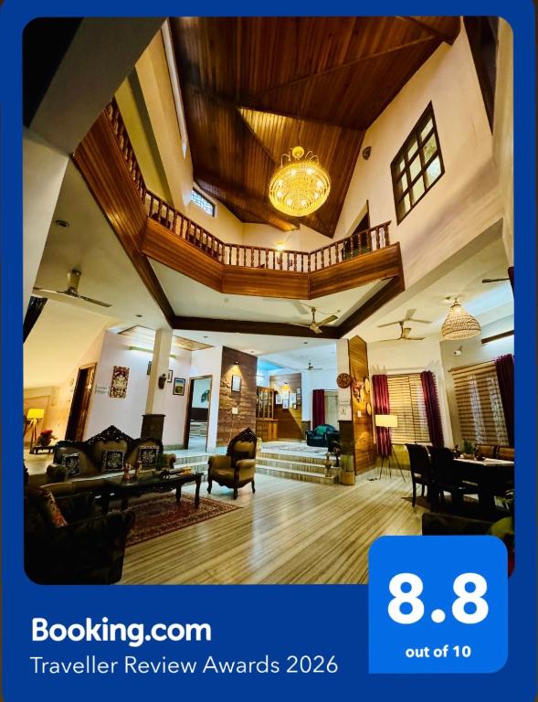 a large living room with a wooden ceiling at Assam Home Hostel Project in Guwahati