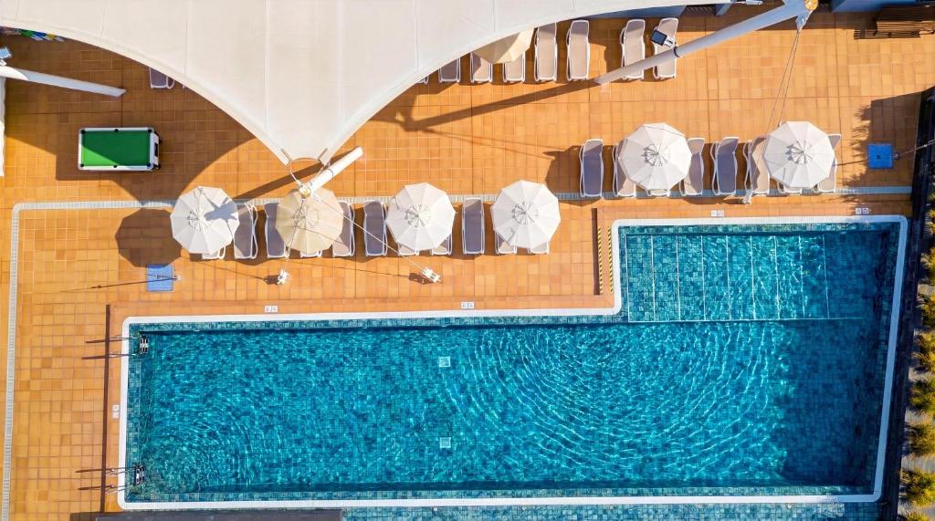 an overhead view of a swimming pool on a cruise ship at Caybeach Meloneras in Meloneras
