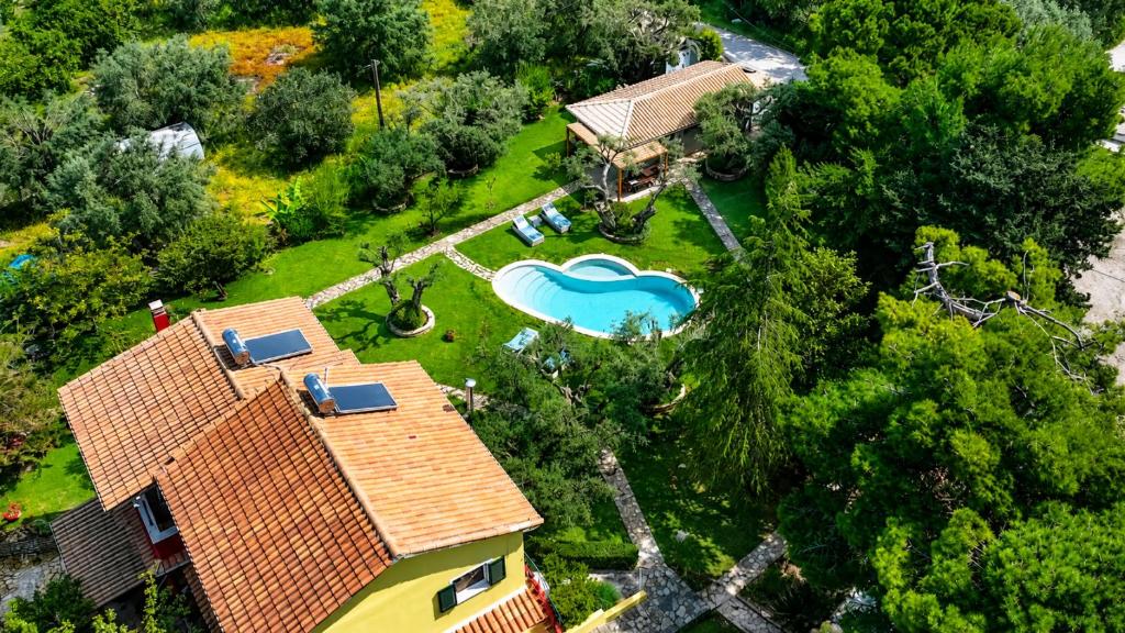 an overhead view of a house with a pool in a yard at Poly's Villa Lefkada in Lefkada