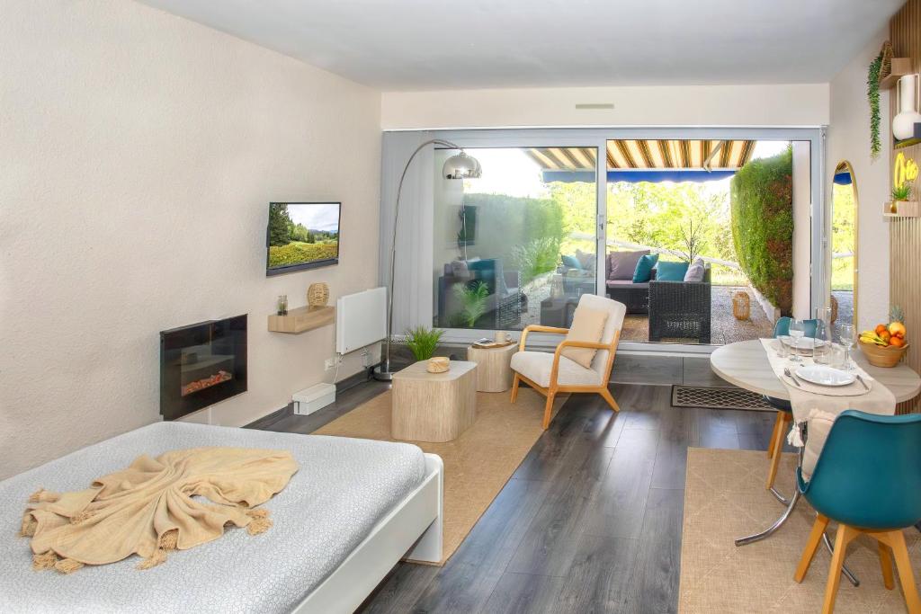a living room with a couch and a table at L'Orée in Turckheim