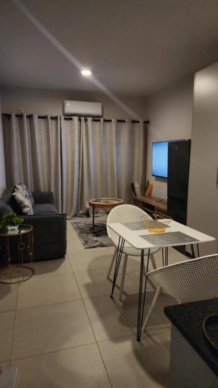 a living room with a couch and a table at Minnestayairbnb in Gaborone