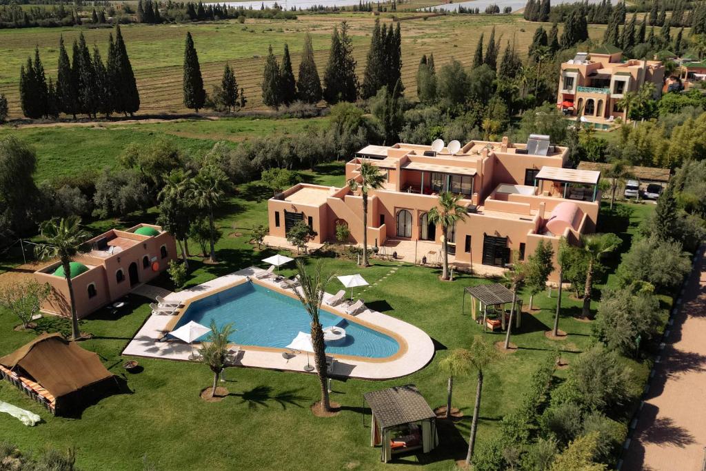an aerial view of a house with a swimming pool at Janat Al Atlas Resort & Spa in Marrakesh