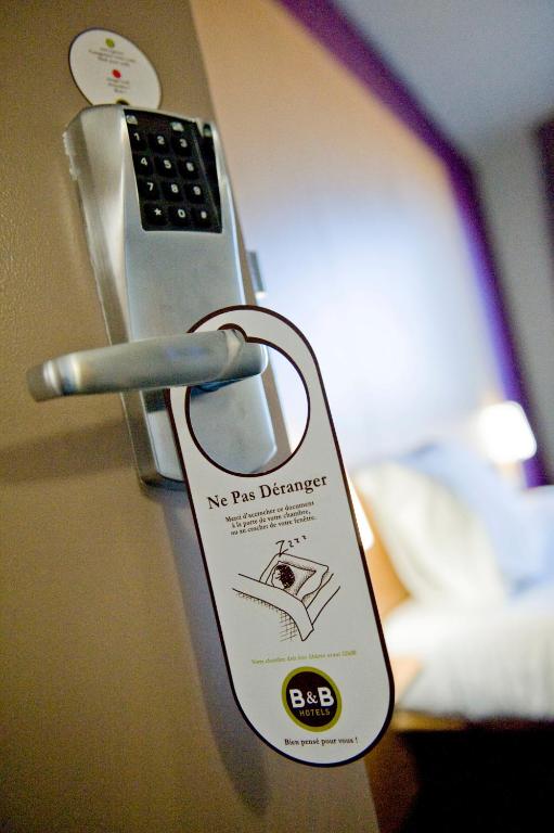 Postel nebo postele na pokoji v ubytování B&B HOTEL Colmar Expo