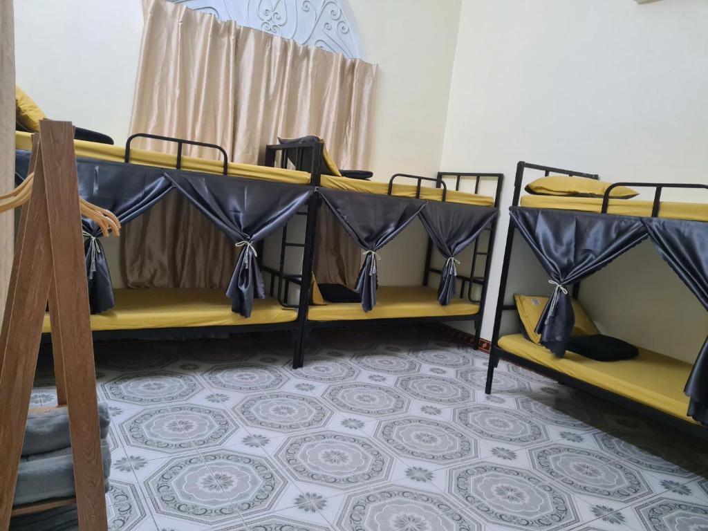 a group of bunk beds in a room at Snow Homestay in Ninh Binh