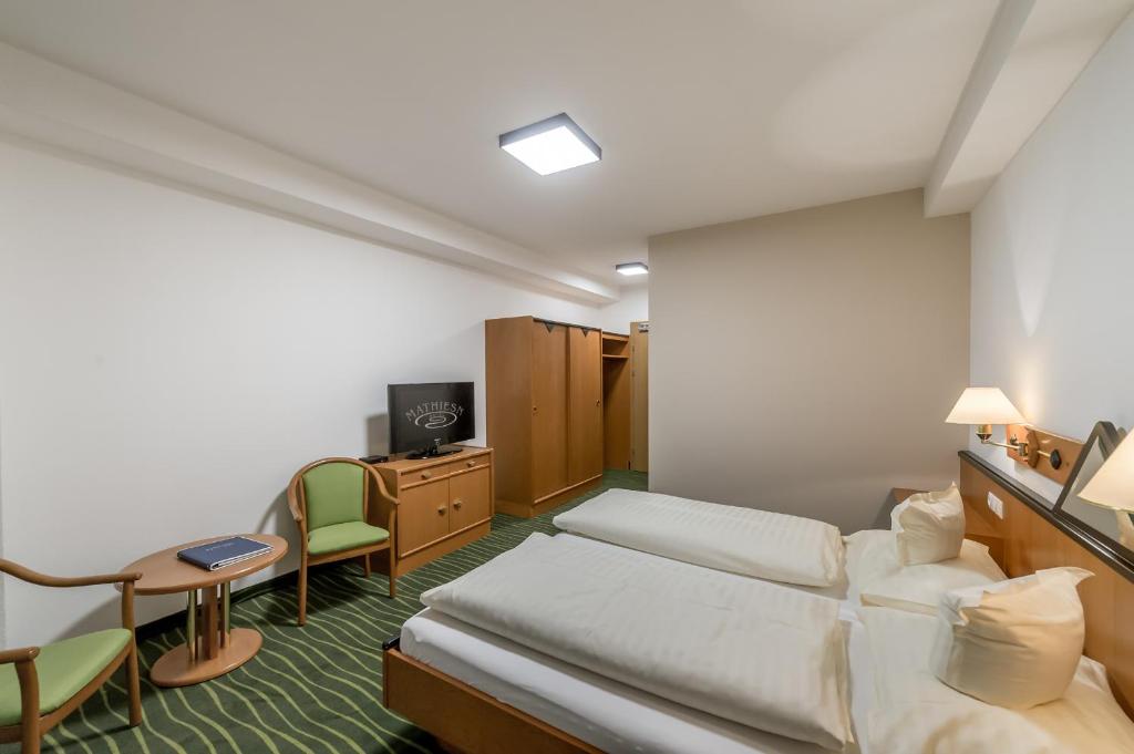 Postel nebo postele na pokoji v ubytování Hotel Mathiesn
