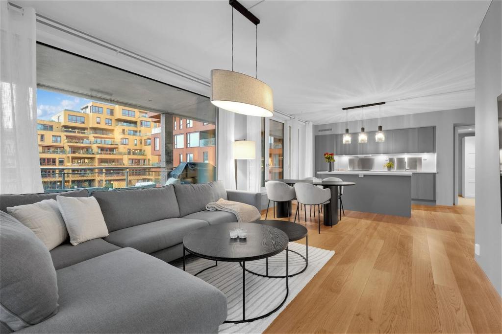 a living room with a couch and a table at Modern Apartment in Ski in Siggerud
