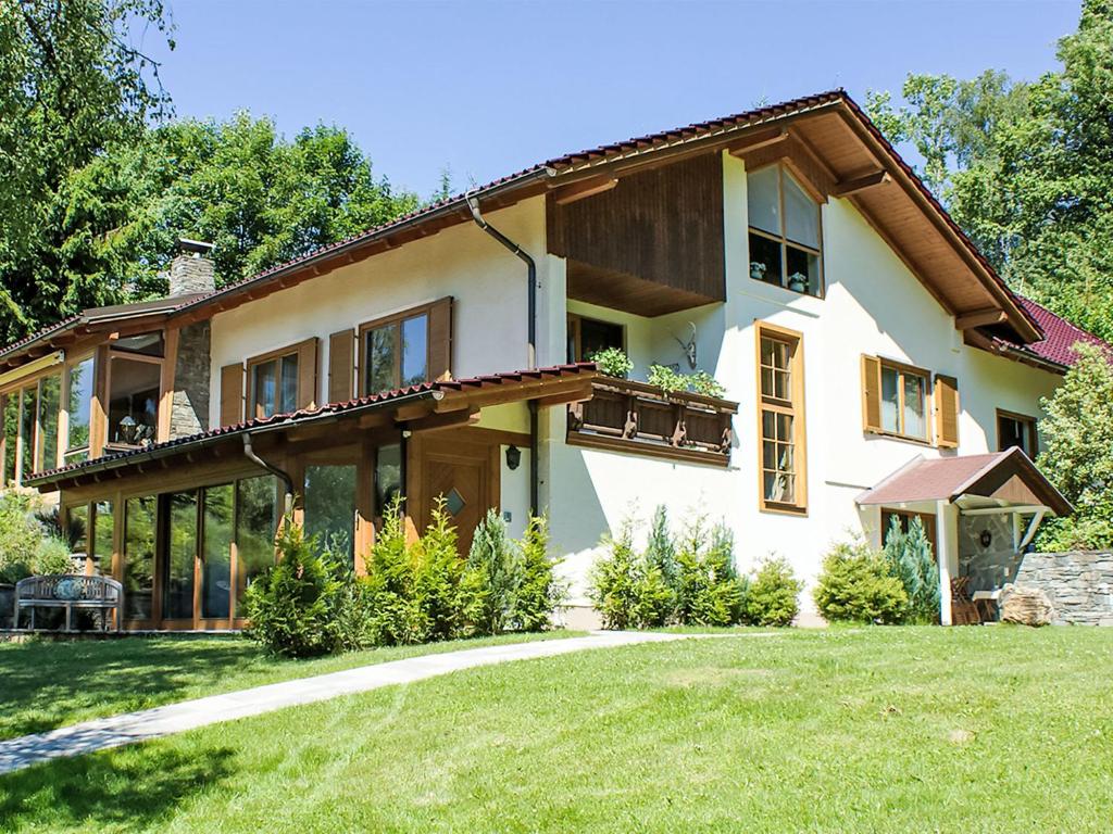 a large house with a lawn in front of it at Apartment Apt- Luna by Interhome in Feldkirchen in Kärnten