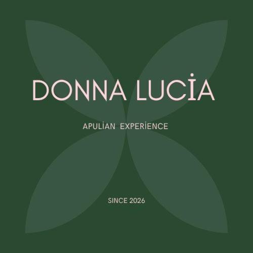 a logo for domina lucija with a green at Donna Lucia Apulian Experience in Ruvo di Puglia