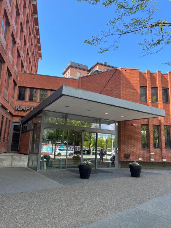 a building with a glass door in front of it at Sky Hotel Malmö City in Malmö