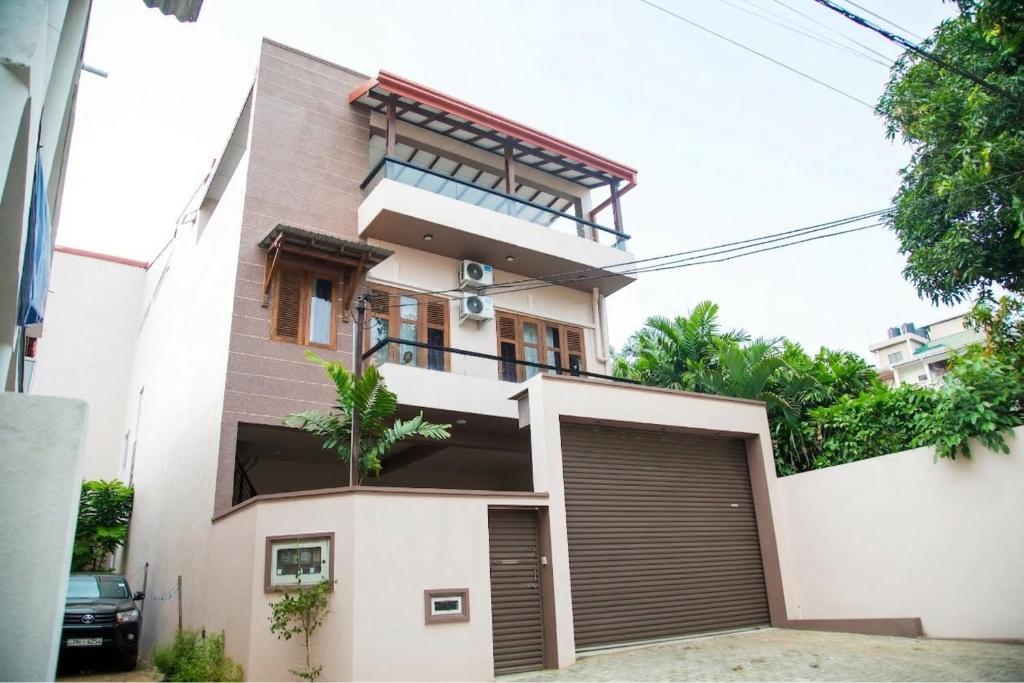 a rendering of a house with a garage at Haven Stay in Sri Jayewardenepura Kotte