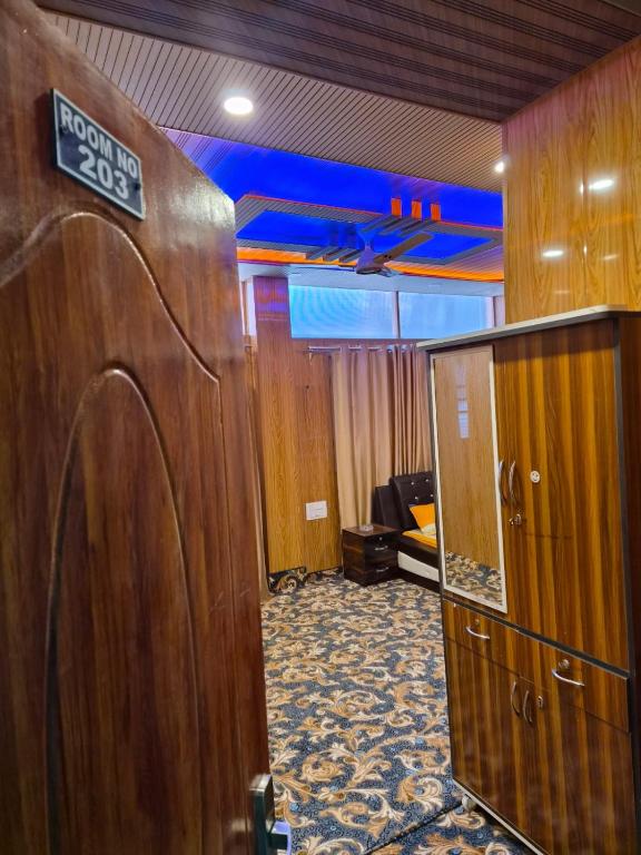 an office with a door with a sign on it at Hotel Dilli Darbar and Restaurant in Bandipura