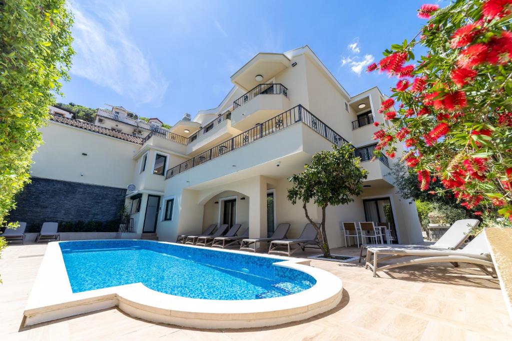 an image of a villa with a swimming pool at Klaris Guest house in Budva