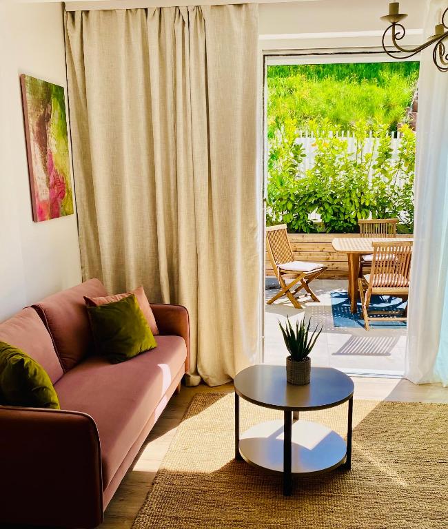 a living room with a couch and a table at "Ellas Home Sekirn" - in 3min am Badestrand in Sekirn