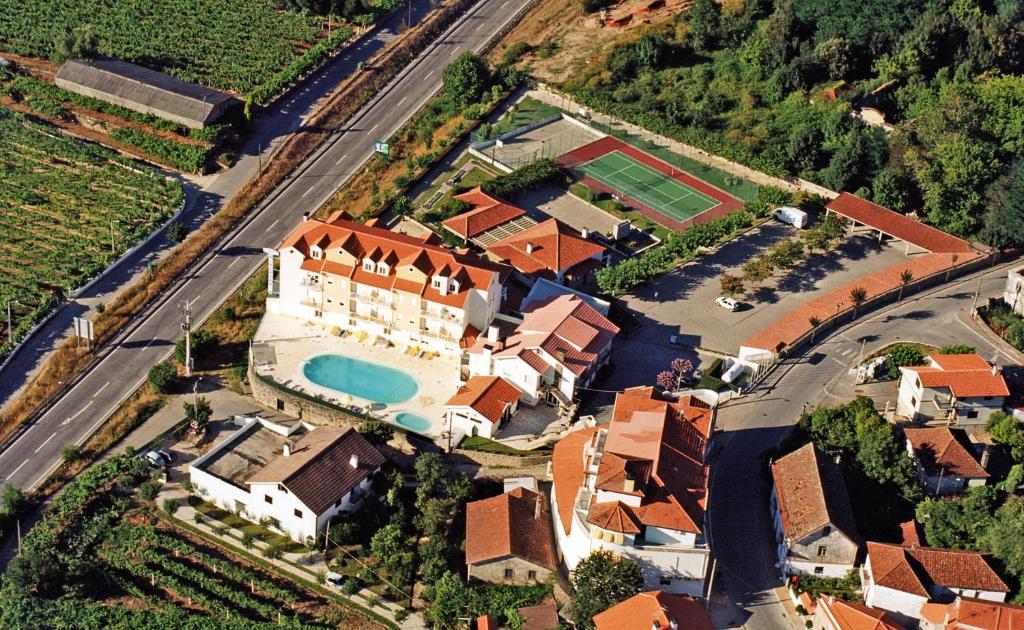 an aerial view of a house with a swimming pool at Hotel Boavista II in Melgaço