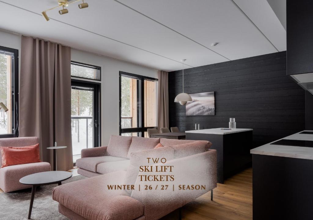 a living room with a couch and a chair at Le Chalet Lingonberry D14 Ski-in Ski-out by Aavalevi in Levi