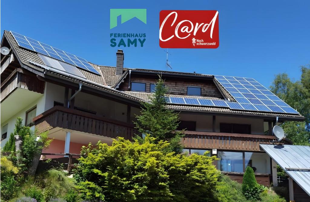 a building with solar panels on the roof at Ferienhaus Samy - Feldberg in Feldberg