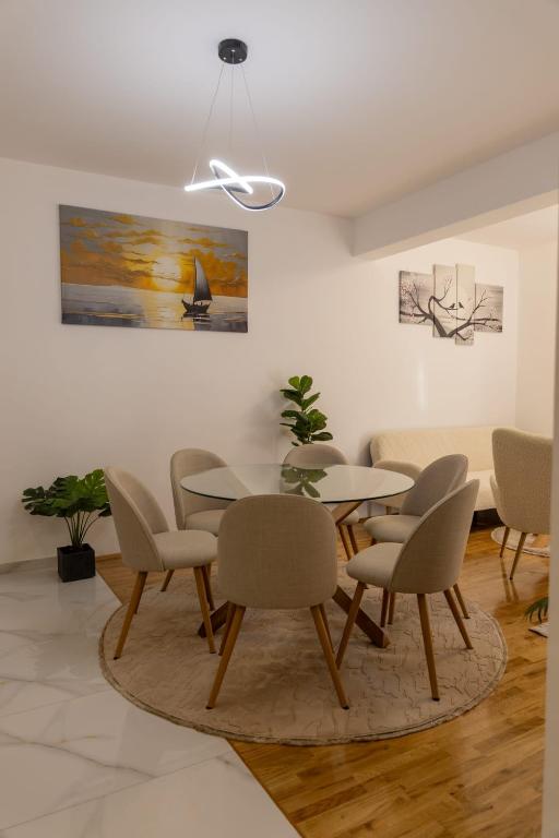 a dining room with a table and chairs at Apartment LANA in Čapljina