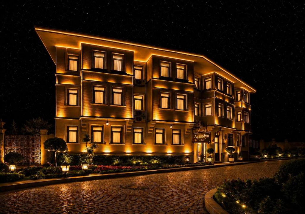 a large building with lights on it at night at Ayasofya Hotel - Special Class in Istanbul