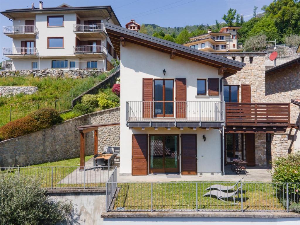 a house on the side of a hill at IseoLakeRental - Casa Cuneo in Costa Volpino