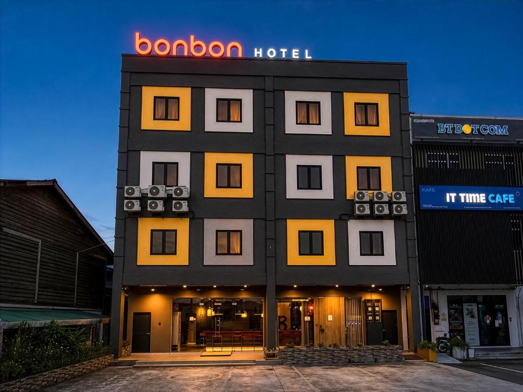 a hotel building with a sign on top of it at Bonbon Hotel in Kluang