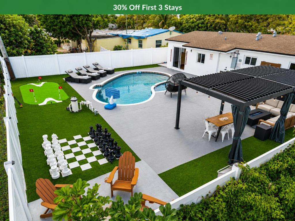 a view of a backyard with a pool and a table at Home at Boulevard Heights, Hollywood in Hollywood